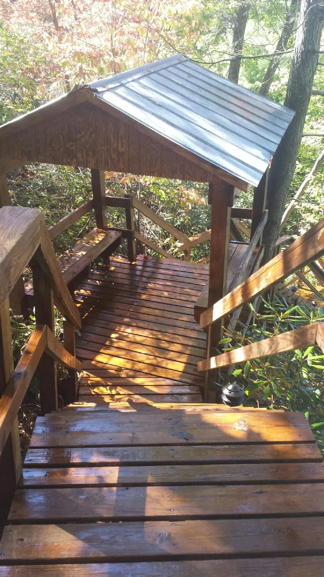 Freshly stained wood walkway and covered shelter with a metal roof in Jbsa Randolph